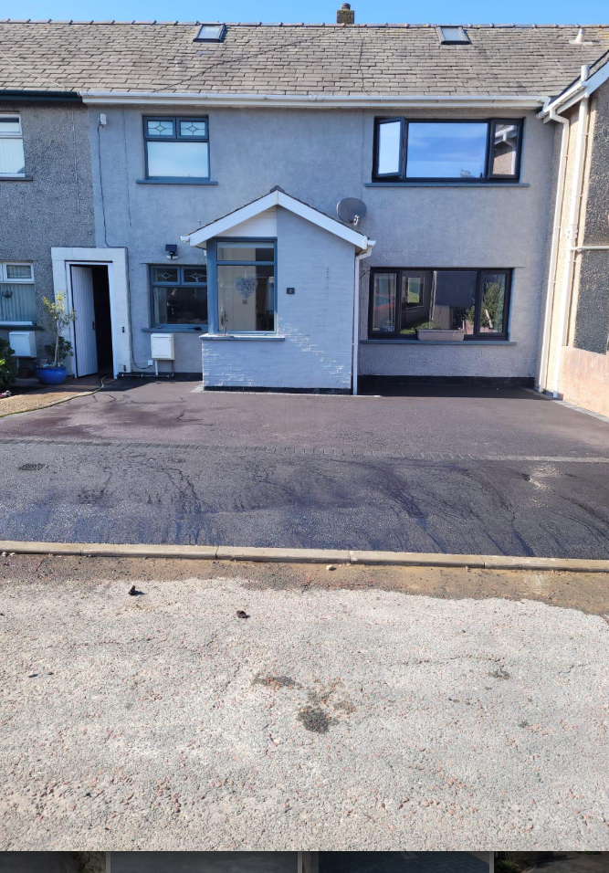 Tarmac driveway in front of a semi-detached home